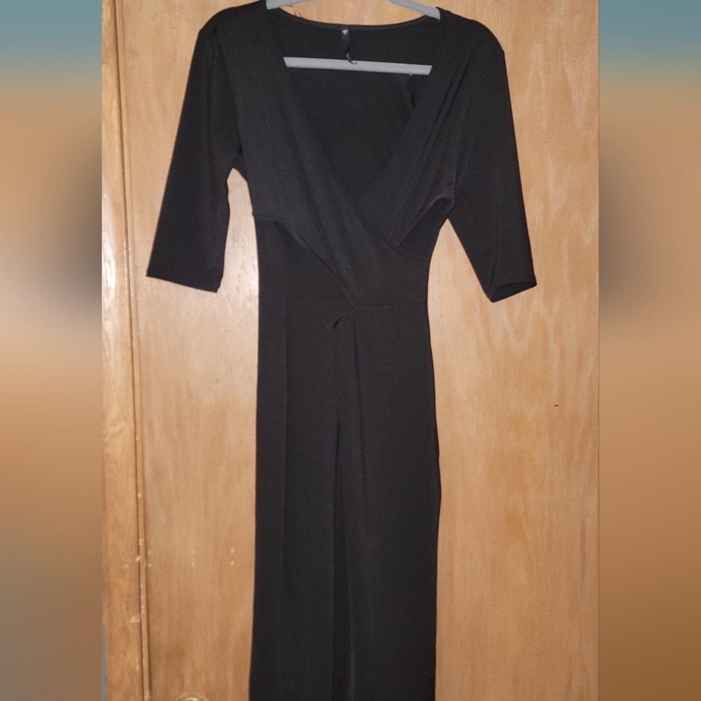 Love Culture Sleek Black Cocktail Dress With Criss Cross Front and Cut Outs.